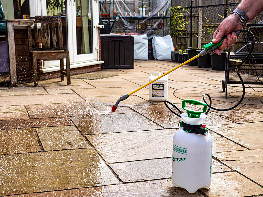 SPOT-ON Long Lasting Patio Cleaner being applied with a pump sprayer